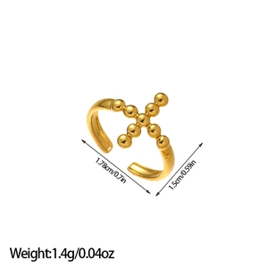 Detailed view of golden cross ring with dimensions 1.78cm height and 1.4g weight