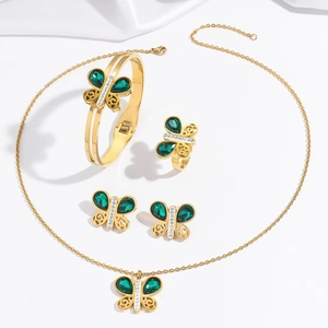 Parure bijoux papillon dorée avec cristaux vert émeraude et pierres étincelantes