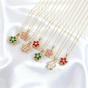 Roterende bloemenketting set van titaniumstaal met kleurrijke zirkonia hangers