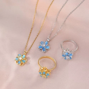 Collier Bague Pendentif Fleur Rotative Pierre Oeil De Chat Bleue Zircon Acier Titane Bijoux Mode Coréenne Femmes