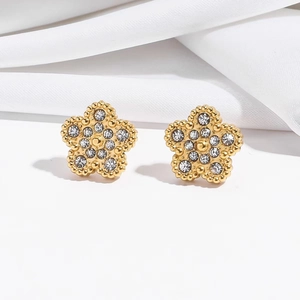 Boucles d'oreilles fleurs dorées à cinq pétales avec cristaux brillants et bords perlés