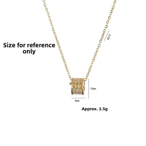 Collier cylindre en titane doré avec gravure 1314 et incrustation de zircon blanc