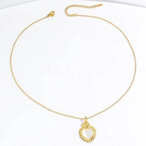 Elegant gold heart pendant necklace featuring a white opal stone inlay and dainty chain