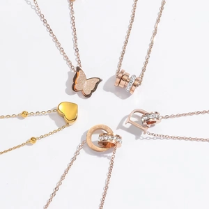 Titanium steel necklaces in rose gold with butterfly, heart, and Roman numeral pendants