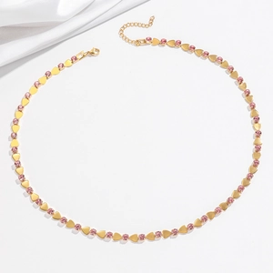 Detail of pink zircon heart necklace with gold finish lobster clasp and adjustable chain