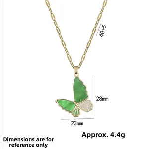 Elegant gold butterfly necklace featuring a green stone wing and sparkling white zircons