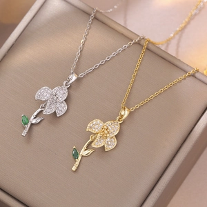 Floral titanium steel necklace with emerald zircon pendant in gold and silver finishes
