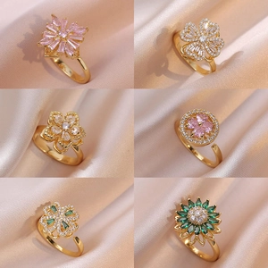 Elegant gold plated rotating zircon rings set with star and floral designs for women
