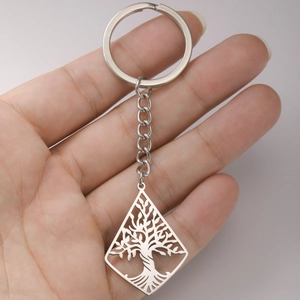 Polished stainless steel Tree of Life keychain with a hollow rhombus pendant in hand