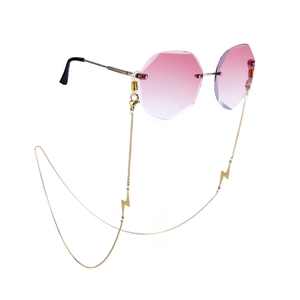 Pink gradient rimless sunglasses with gold lightning charm chain and metal frame