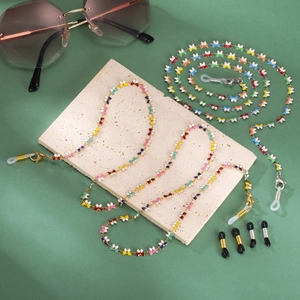 Detail of colorful butterfly eyewear chains with lobster clasps and silicone loops
