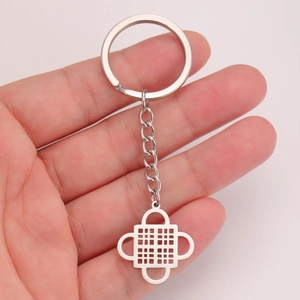 Handheld silver Adinkra symbol keychain with geometric pendant in polished stainless steel