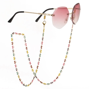 Pink gradient rimless sunglasses featuring a decorative colorful butterfly link chain strap