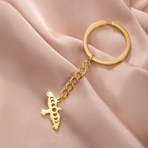 Golden stainless steel eagle keychain featuring hollow moon phase cutout pendant
