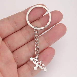Polished stainless steel eagle keychain featuring unique celestial moon phase cutouts
