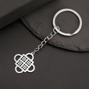 Close-up of polished stainless steel Adinkra symbol keychain with durable link chain