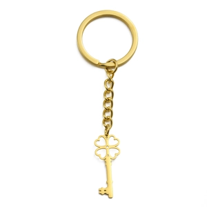 Golden titanium steel keychain with four-leaf clover pendant and key-shaped charm