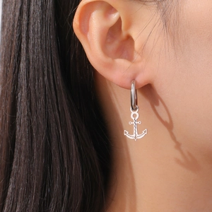 Silver stainless steel anchor drop earrings with geometric design for women on model
