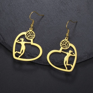 Macro shot of gold stainless steel heart earrings with volleyball player silhouette