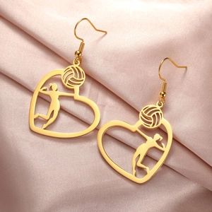 Detailed close-up of golden stainless steel heart earrings with volleyball player motif