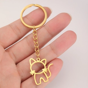Porte-clés chat évidé en acier inoxydable doré au design minimaliste et élégant