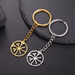 Detail of gold and silver stainless steel keychains with hollow cuneiform star pendants
