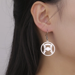 Surgical steel baseball stitch hollow hoop earrings worn by a model in silver finish