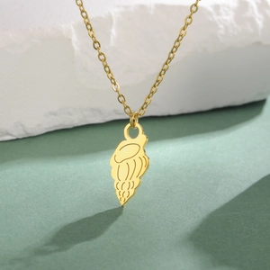 Minimalist gold titanium steel necklace featuring a textured jellyfish shell pendant