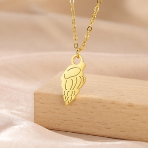 Close-up of minimalist gold hollow jellyfish pendant on a stainless steel chain