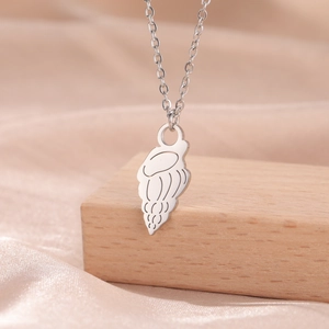 Detailed close-up of a minimalist silver jellyfish shell pendant on a thin cross chain link
