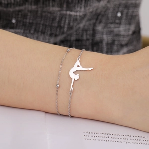 Detail view of double-layer stainless steel bracelet with gymnast silhouette pendant