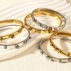 Vintage floral engraved gold and silver stainless steel bangles with bow motifs