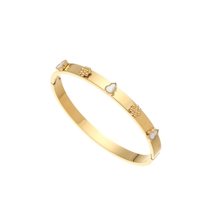 Detail of 18K gold-plated stainless steel bangle with white shell heart and flower motifs