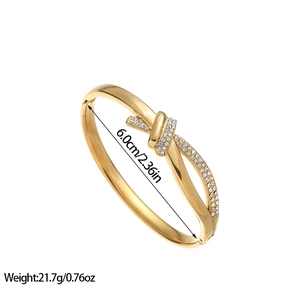Vintage 18K gold-plated stainless steel knot bangle with sparkling white rhinestones