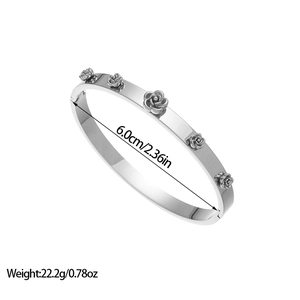 Detailed view of silver stainless steel bangle with floral rose relief 6.0cm diameter