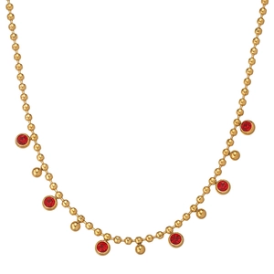 Close-up of 18k gold plated beaded necklace with vibrant red rhinestone pendants