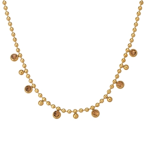 Close-up of gold beaded chain necklace featuring amber crystal and polished metal sphere charms