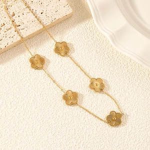 Elegant gold plated stainless steel necklace featuring five textured flower pendants