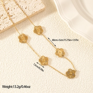 Detail of a 40cm+5cm gold stainless steel five-petal flower necklace with 1.5cm charms