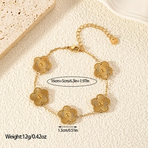 Close-up of golden double-sided five-leaf flower necklace with size measurement details