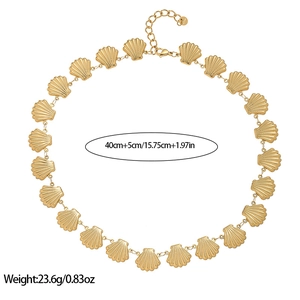 Detailed view of gold scallop shell necklace with 18k plating and 40cm plus 5cm sizing