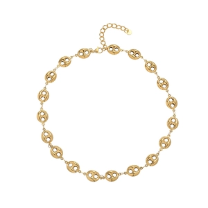 Detailed macro view of gold-plated pig nose chain with lobster clasp and S925 tag