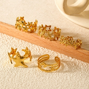 Set of five adjustable gold stainless steel rings featuring celestial moon and star designs
