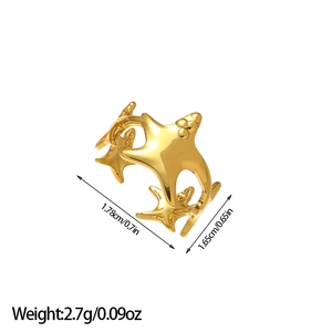 Golden starfish open ring with three connected sea stars on a minimalist white background