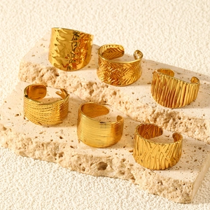 Set of 6 gold adjustable stainless steel rings featuring diverse textured hammer finishes