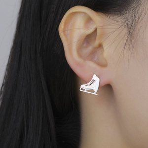 Polished silver ice skate stud earrings for women in a minimalist stainless steel style