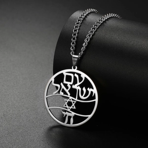 Detailed macro view of silver stainless steel Star of David pendant with Hebrew engraving