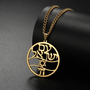 Close-up of gold hollow Star of David pendant with Hebrew engraving on cross chain