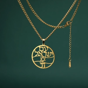 Detail of gold-plated Star of David pendant with Hebrew engraving on a cable chain