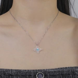 Silver Celtic knot necklace in stainless steel with a round light blue stone pendant